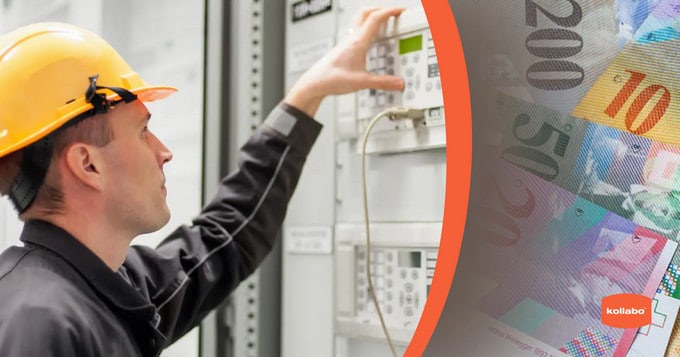 A man in a hard hat is working on an electrical panel.