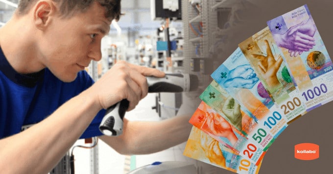 Ein Mann arbeitet in einer Fabrik an einer Maschine.