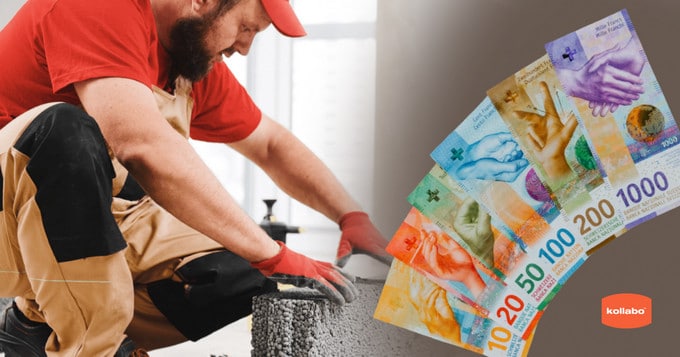 Ein Mann mit rotem Hut arbeitet an einem Stück Beton.