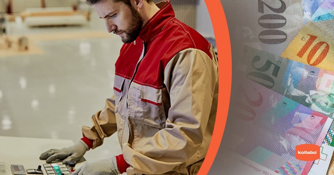 Ein Mann arbeitet in einer Fabrik an einer Maschine.